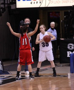 Sophomore Kendra Wycoff tries to bring the ball into play against the Centennial Cougars during the first round of the State Tournament on March 18.