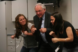 Visiting the newspaper editors, Justice Paul Anderson demonstrates how the judicial system pushes up against the legislative and executive branches by comparing the system to boxing out in basketball.