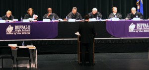 Members of the Minnesota Supreme Court listen to arguements from the defense attorney in the Performing Arts Center at the start of oral arguments. Photo by Matt Ebeling