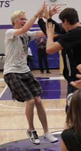 Senior Robert Malmstein is greeted by other candidates for Homecoming Royalty at the pep fest on Friday. Photo by Joel Morehouse