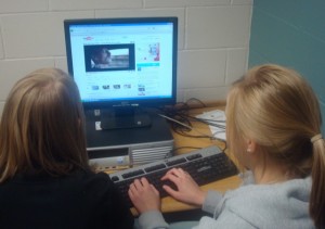 Seniors Jacklyn Blauert and Morgan Berg use YouTube during class