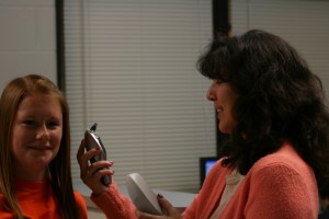 School Nurse Justine Stephens takes Junior Kendra Durst's temperature. Photo by Megan Downing