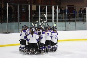 Girls' Hockey gathering over then net before the game against Wayzata