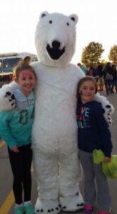 Northwinds Elementary alums pose with Bizzard, the former mascot of the school. 