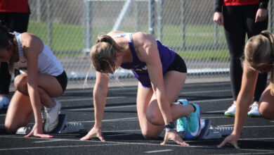 Rose Lamberts '26 at the starting blocks before a hurdles race on April 28.
