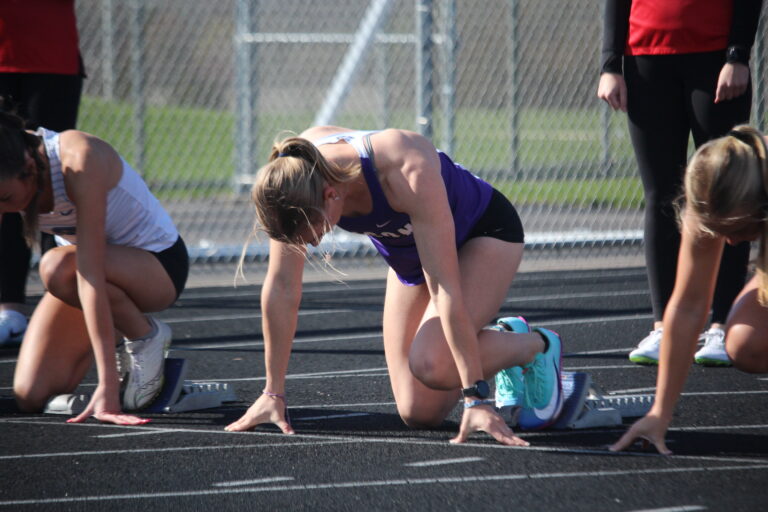 Rose Lamberts '26 at the starting blocks before a hurdles race on April 28.