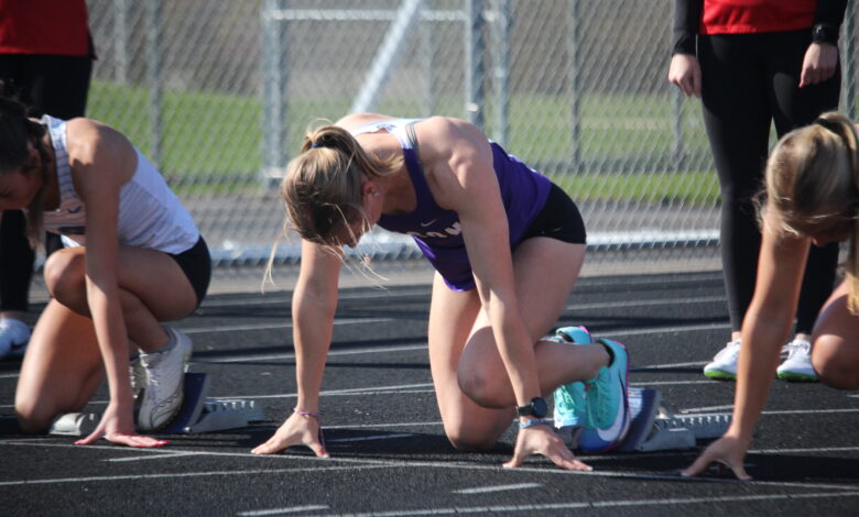 Rose Lamberts '26 at the starting blocks before a hurdles race on April 28.