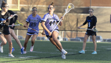 Hannah Rosso '28 carries the ball in a game on May 18. Photo by Braxton Teschendorf