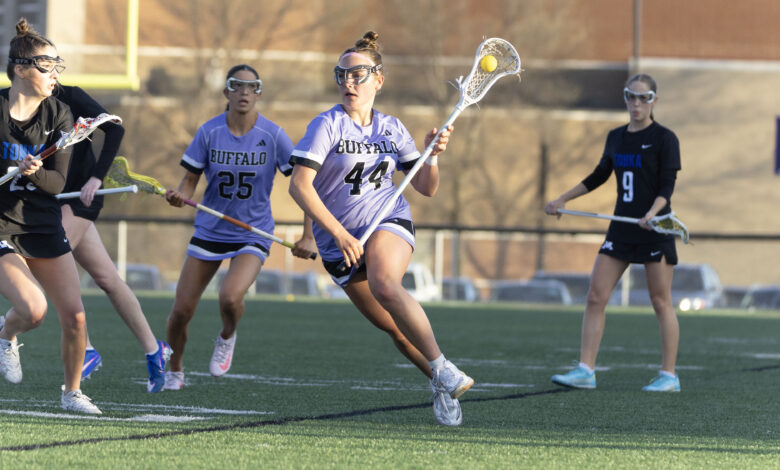 Hannah Rosso '28 carries the ball in a game on May 18. Photo by Braxton Teschendorf