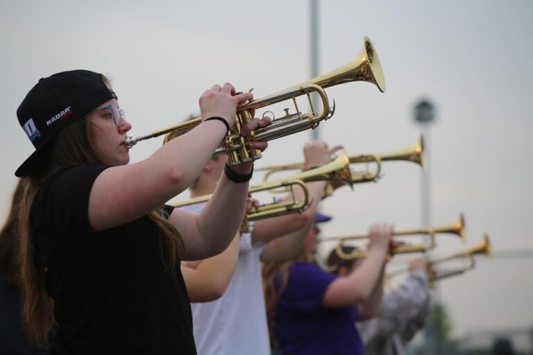 Lilah Dongoski plays the trumpet during a marching band rehearsal on May 9.