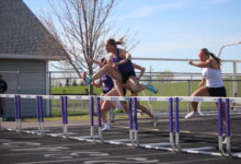 Rose Lamberts competes in the hurdles at the home track meet on April 28.