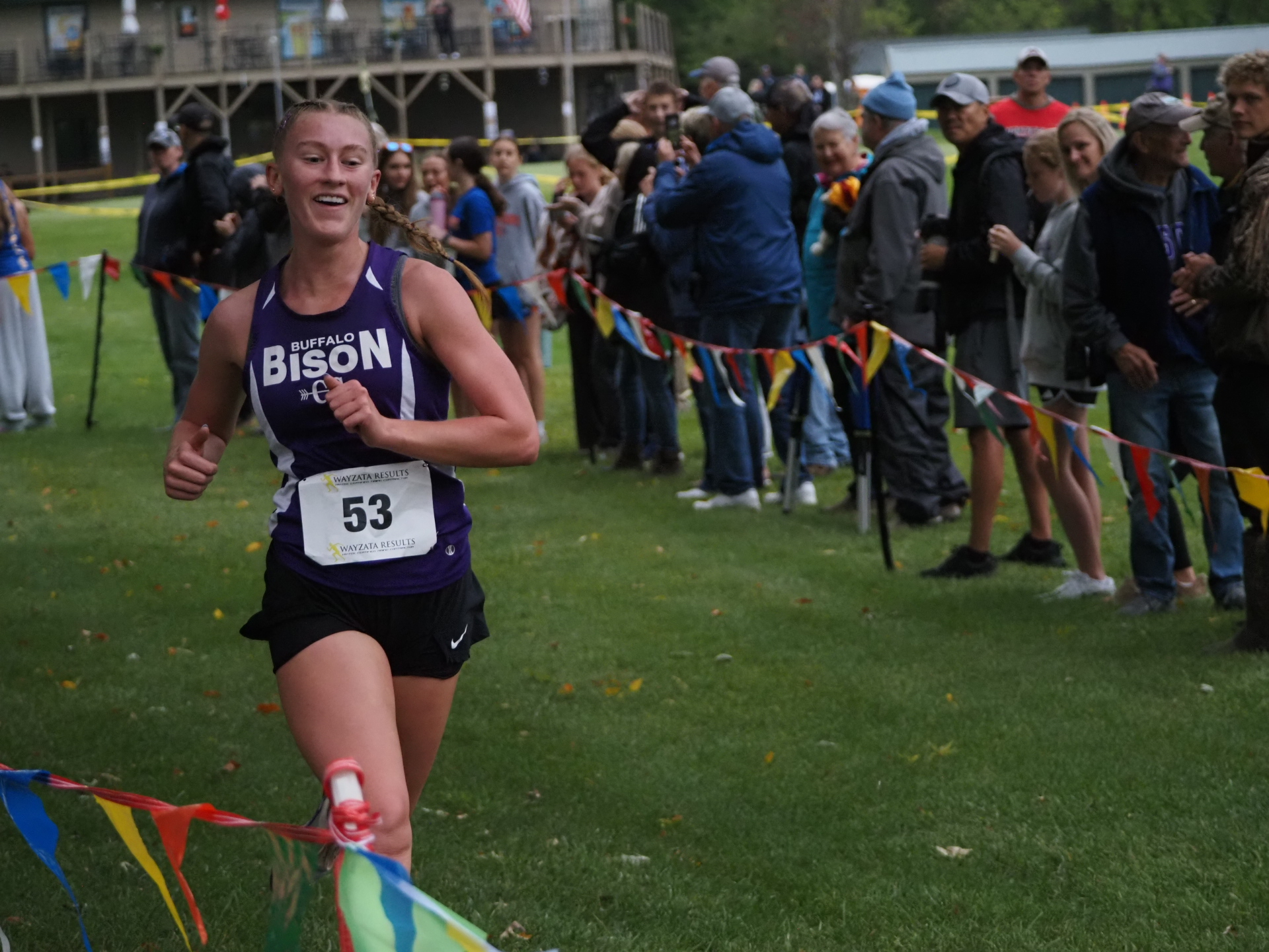 Cady Macheel smiling as she sees the clock at the finish line.