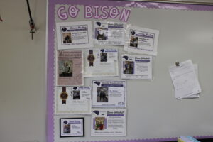 Wishart displays certificates she received from student athletes inviting her to Teacher Appreciation games.