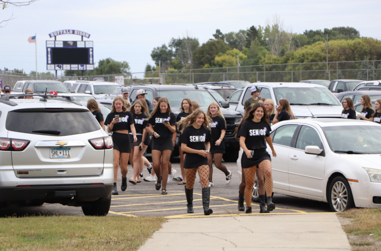 Seniors enter the building wearing black on Class Color Day for the Senior Stampede.