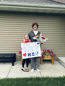 Tyson Aspen asks Mia Weis to homecoming with a sign