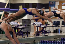 Estelle Bergs '30 leaps from the starting blocks in her race against the Eden Prairie Eagles on September 24. Bergs scored key Varsity points in a very close meet.
