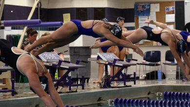 Estelle Bergs '30 leaps from the starting blocks in her race against the Eden Prairie Eagles on September 24. Bergs scored key Varsity points in a very close meet.