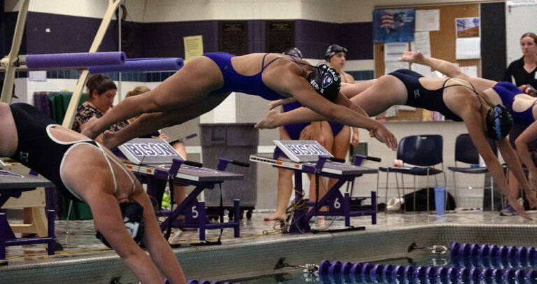 Estelle Bergs '30 leaps from the starting blocks in her race against the Eden Prairie Eagles on September 24. Bergs scored key Varsity points in a very close meet.