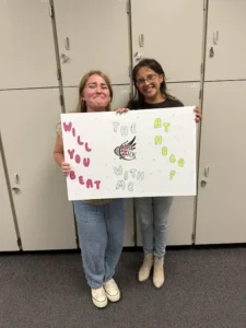 Meg Reeves asks Elly Kohls to homecoming with a sign