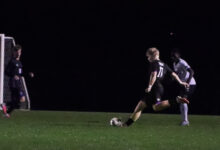 Guthrie Lind takes a shot during the boys soccer game against Rogers on September 29.