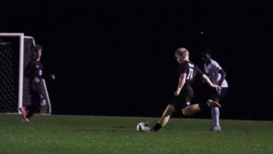 Guthrie Lind takes a shot during the boys soccer game against Rogers on September 29.