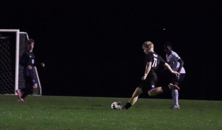 Guthrie Lind takes a shot during the boys soccer game against Rogers on September 29.
