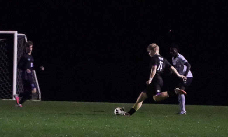 Guthrie Lind takes a shot during the boys soccer game against Rogers on September 29.