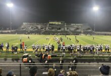 Players take the field during the game as seen from the stands