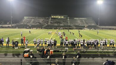 Players take the field during the game as seen from the stands
