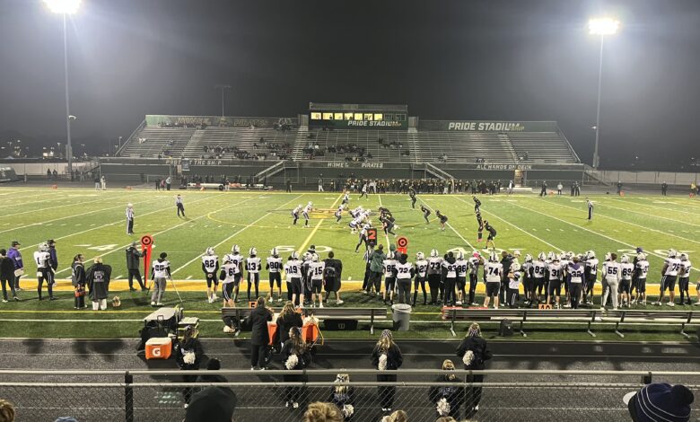 Players take the field during the game as seen from the stands