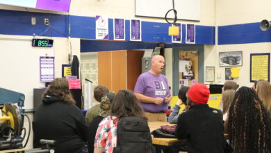 A teacher is presenting to students.