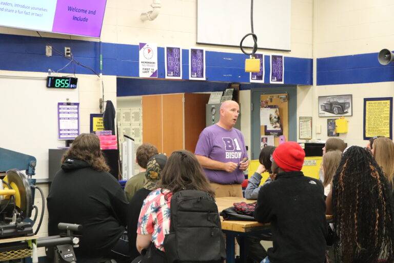 A teacher is presenting to students.