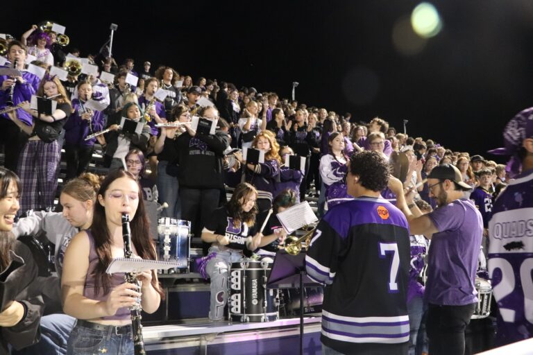 Members of the pep band perform during the Homecoming Game.