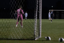 Bison Goalie gives valiant efforts to protect the net.