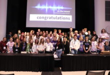 The Hoofprint staff are taking a group photo at a Journalism Convention.