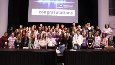The Hoofprint staff are taking a group photo at a Journalism Convention.
