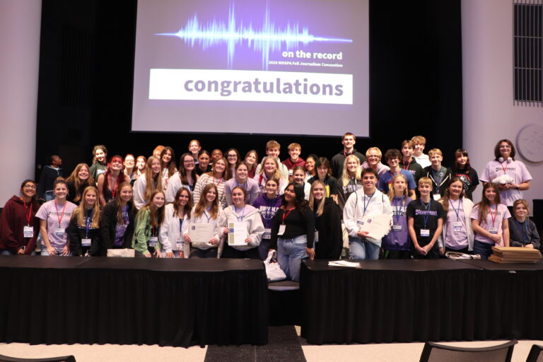 The Hoofprint staff are taking a group photo at a Journalism Convention.