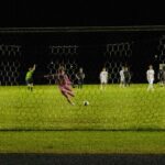 Bison goalie Gerhard Ungaro 27' passes soccer ball to teammates while taking a goal kick
