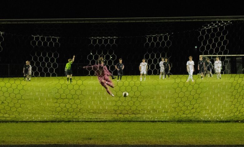 Bison goalie Gerhard Ungaro 27' passes soccer ball to teammates while taking a goal kick