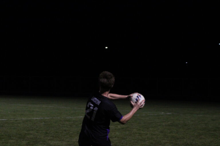 Stone Hoel '27 throws the ball in during the second half of the team's win against Alexandra on October 5.